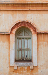 green window on old retro building.