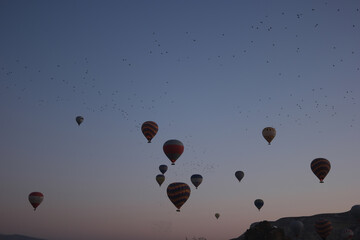 Cappadocia hot air balloon flight. Beautiful sunset sky background.