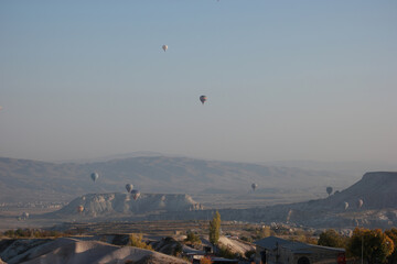 Mountains landscape with hot air balloons. Rural Cappadocia mountains landscape.
