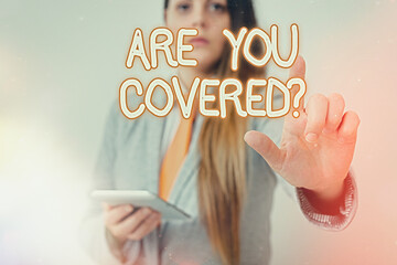 Writing note showing Are You Covered Question. Business concept for asking if they had insurance in...