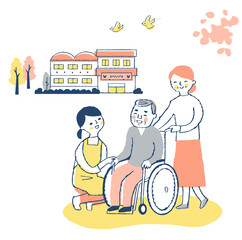 車椅子のシニア男性と介護ヘルパー　施設