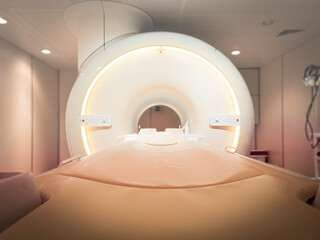 MRI Scanner or Magnetic resonance imaging scanner machine in Hospital isolated on blurred MRI Room...