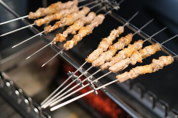 mutton kebabs on grill. Traditional Chinese food