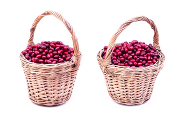 Fototapeta na wymiar Fresh cornel berries. Fresh dogwood red berries with green leafs in wooden basket isolated on white background.