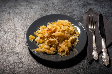 Fried cabbage on a plate. Healthy eating.