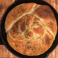 Freshly baked Zaatar bread in cast iron pan