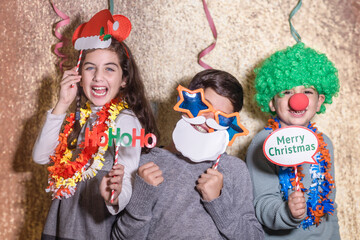 Three kids celebrating New Years Eve Christmas Day at home