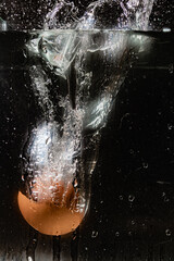 splash of a dropped chicken egg in water