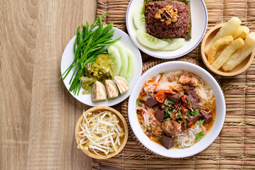Northern Thai food (Kanom Jeen Nam Ngeaw), Rice noodles spicy soup with pork and pork blood eating with fresh vegetables and pork rind