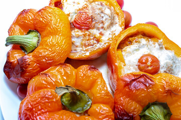 Stuffed with minced meat peppers. Top view on white background