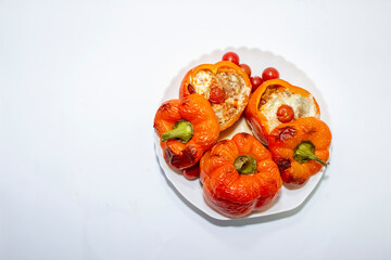 Stuffed with minced meat peppers. Top view on white background