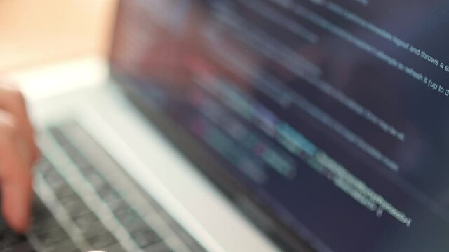 Hacker work online. Coder testing virus security system. freelance man design web software. Develop internet project. Closeup coding on screen, hands type html code and programming on screen laptop.