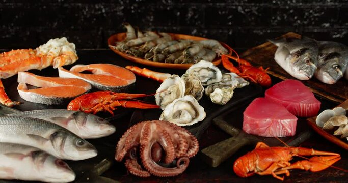 The types of different seafood and fish on table rotate.