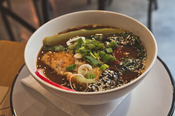 Delicious Japanese vegan dish - ramen soup with noodles, vegetables and shiitake mushrooms