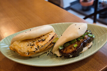 Delicious vegan bao buns with tempura eggplant, wasabi mayonnaise and green onion
