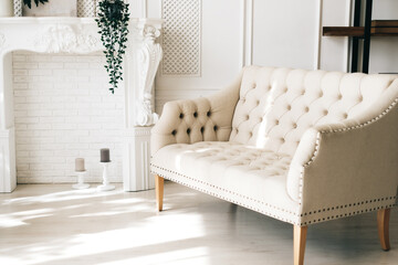 White comfortable sofa in elegant living room.
