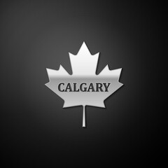 Silver Canadian maple leaf with city name Calgary icon isolated on black background. Long shadow style. Vector.