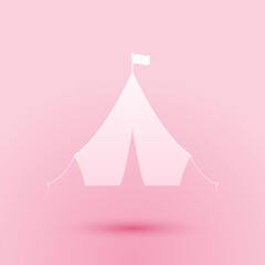 Paper cut Tourist tent with flag icon isolated on pink background. Paper art style. Vector.