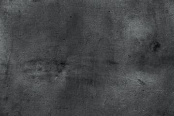 Black rough concrete wall texture - dark grunge background