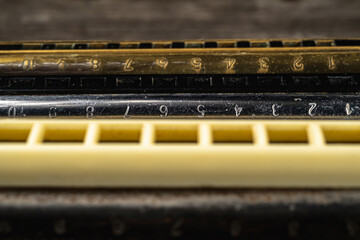 musical instruments vintage harmonics diatonic and chromatic on old wooden desk. world music day