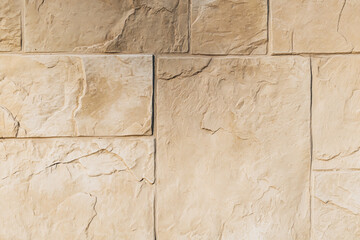 Natural contrast masonry wall stone granite is a pattern of texture ivory color, material and background with stones. decor.