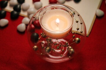 warm Christmas atmosphere, 
decorative flaming candle
