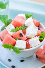 Close up of a summer salad with watermelon, feta and mint