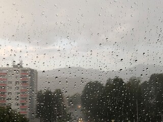 Rainy intersection from behind window.