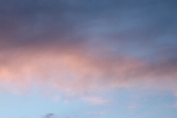 Colourful evening blue sky with pink and purple clouds at sunset