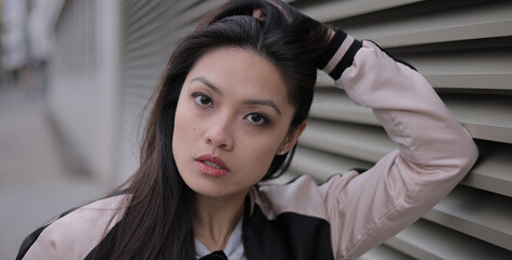 Young Asian woman in a city - people photography