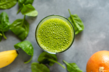 Spinach smoothie with orange, grapefruit and banana.