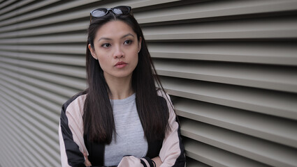 Young Asian woman in a city - people photography