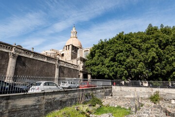 Obraz premium Terme romane, Terme dell Acropoli and Chiesa di San Nicolo Arena catholic church in Catania, Sicily, Italy at sunny day