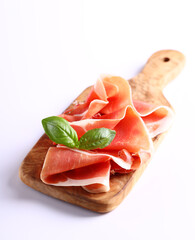 italian parma ham with basil leaf