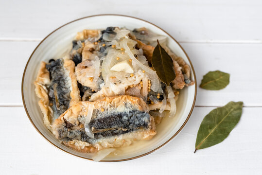 Fried herring in a vinegar marinade with a bay leaf, mustard and allspice