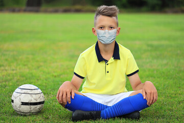 young boy in a medical mask. infectious disease epidemic