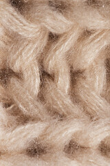 macro texture of knitted cream scarf