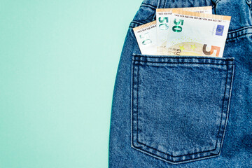 Money in pocket. Euro in pocket jeans isolated. 150 euros in jeans. Copy space.