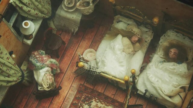 Reduced Bedroom With Sleeping Family Integrated Under Glass In The Pavement Of The Pedestrian Sidewalk