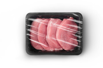 Sealable black plastic tray with raw meat schnitzels top-view. Packaging template mockup...