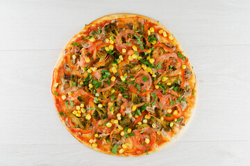 Big pizza isolated on white background. Tasty fast food at quarantine coronavirus covid-19 period. Food delivery for people who stay at home