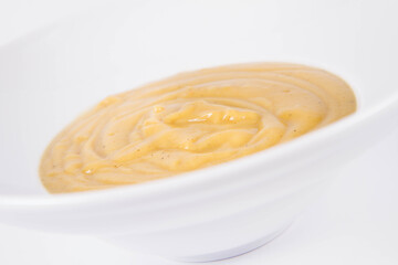 Pumpkin soup on a plate on a white background