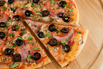 Pizza top view cutted on 8 pieces and one pushed forward. Advert for pizzeria caffee and restaurant. Food delivery at quarantine covid-19 concept.