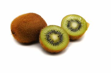 Kiwi whole, and two halves cut into segments isolated on a white background