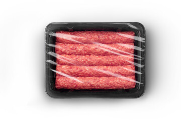 Sealable black plastic tray filled with fresh raw beef kebabs top-view. Packaging template mockup collection. With clipping Path included.
