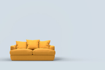 Yellow couch with pillows on studio grey background.