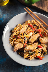 Chicken chow mein. Fried noodles with chicken and vegetables