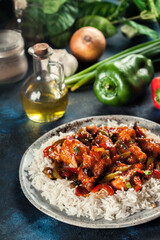 Sweet and sour chicken with colorful bell pepper with rice