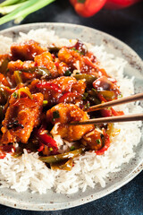 Sweet and sour chicken with colorful bell pepper with rice