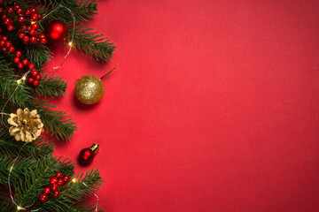Obraz na płótnie Canvas Christmas flat lay background with fir tree and decorations.
